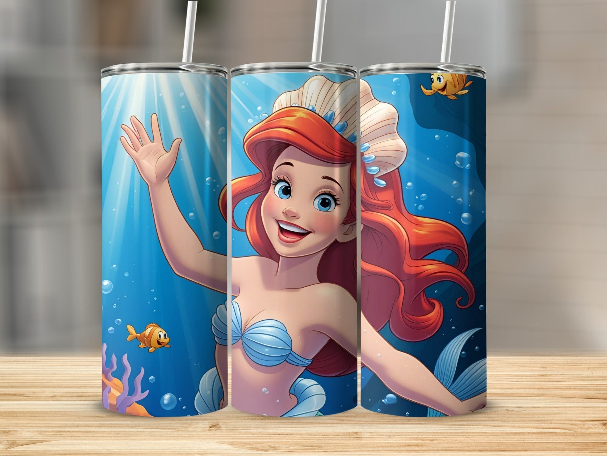 Ariel the mermaid smiles and waves from an underwater scene with fish.