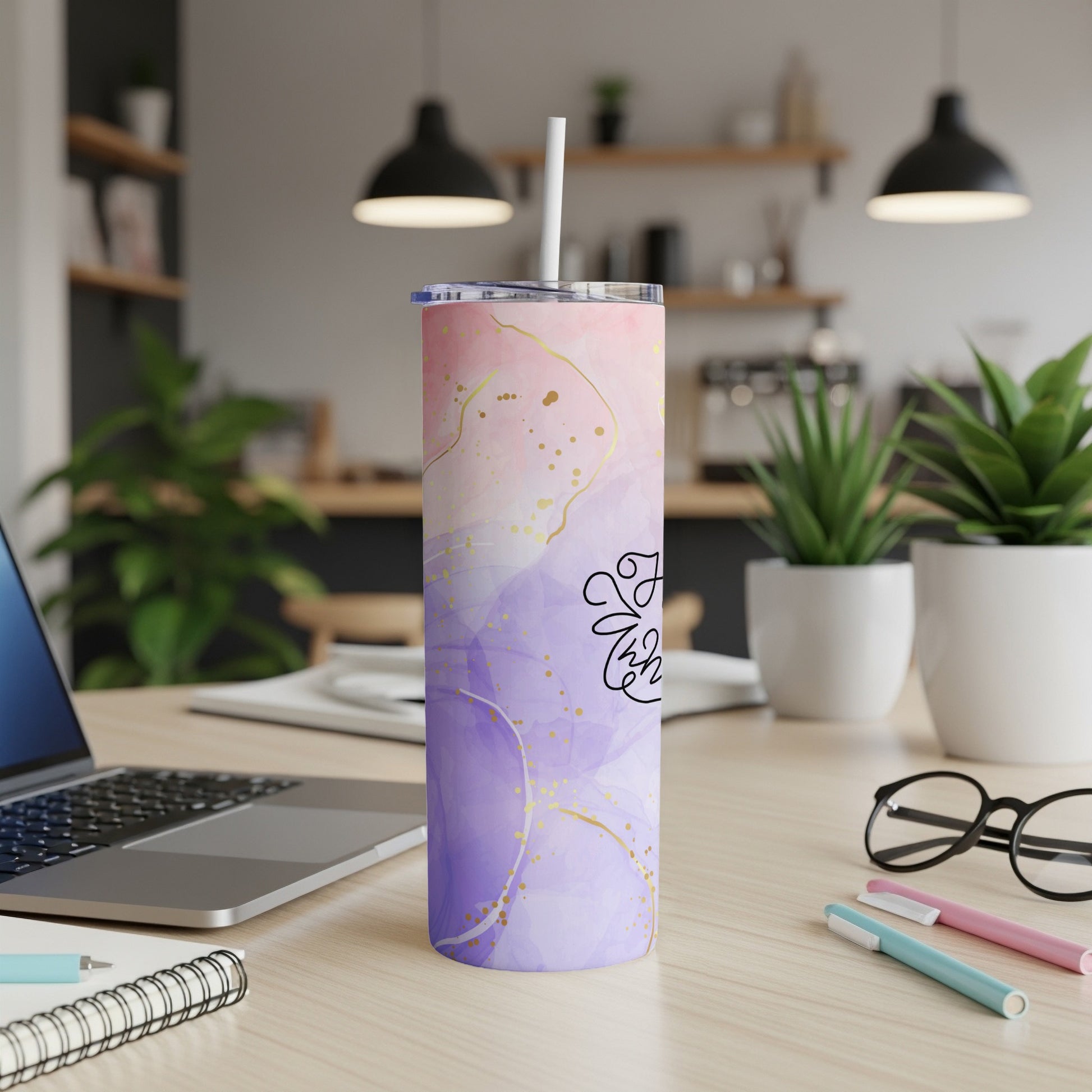 Purple and pink marbled tumbler with gold splatter and floral design.