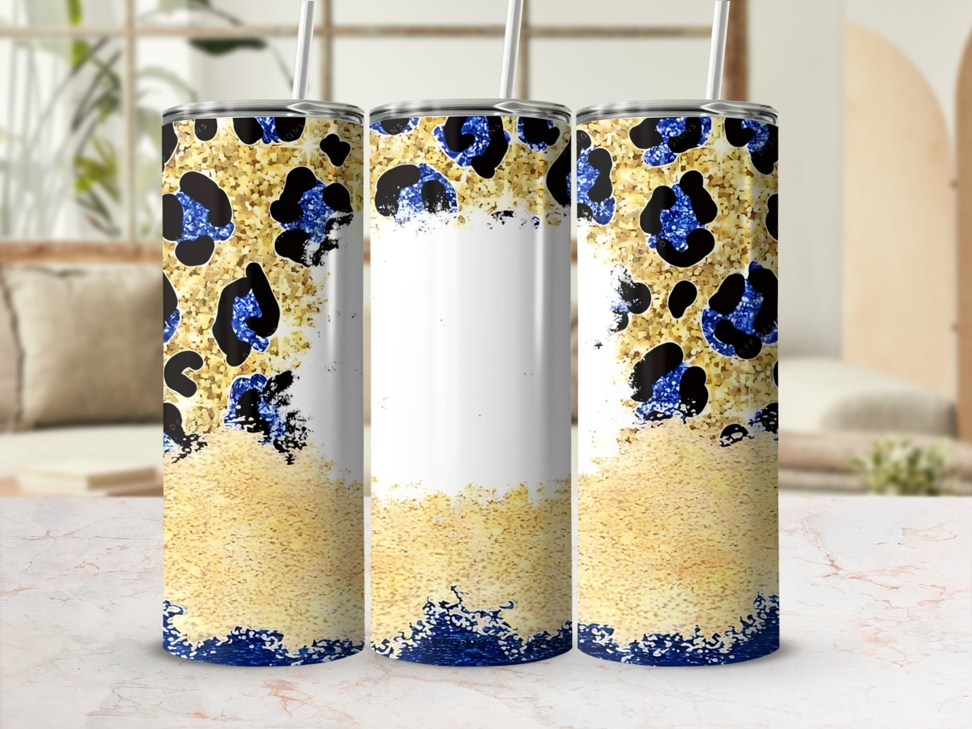 Three tall tumblers with a gold glitter and leopard print design.