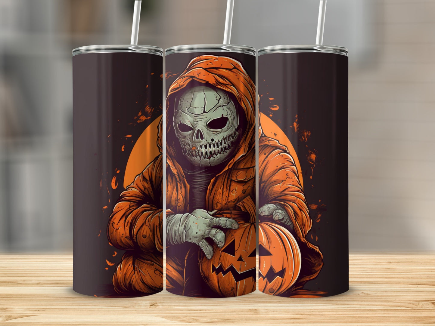 Three tumblers featuring a skeleton in an orange robe holding a jack-o'-lantern.