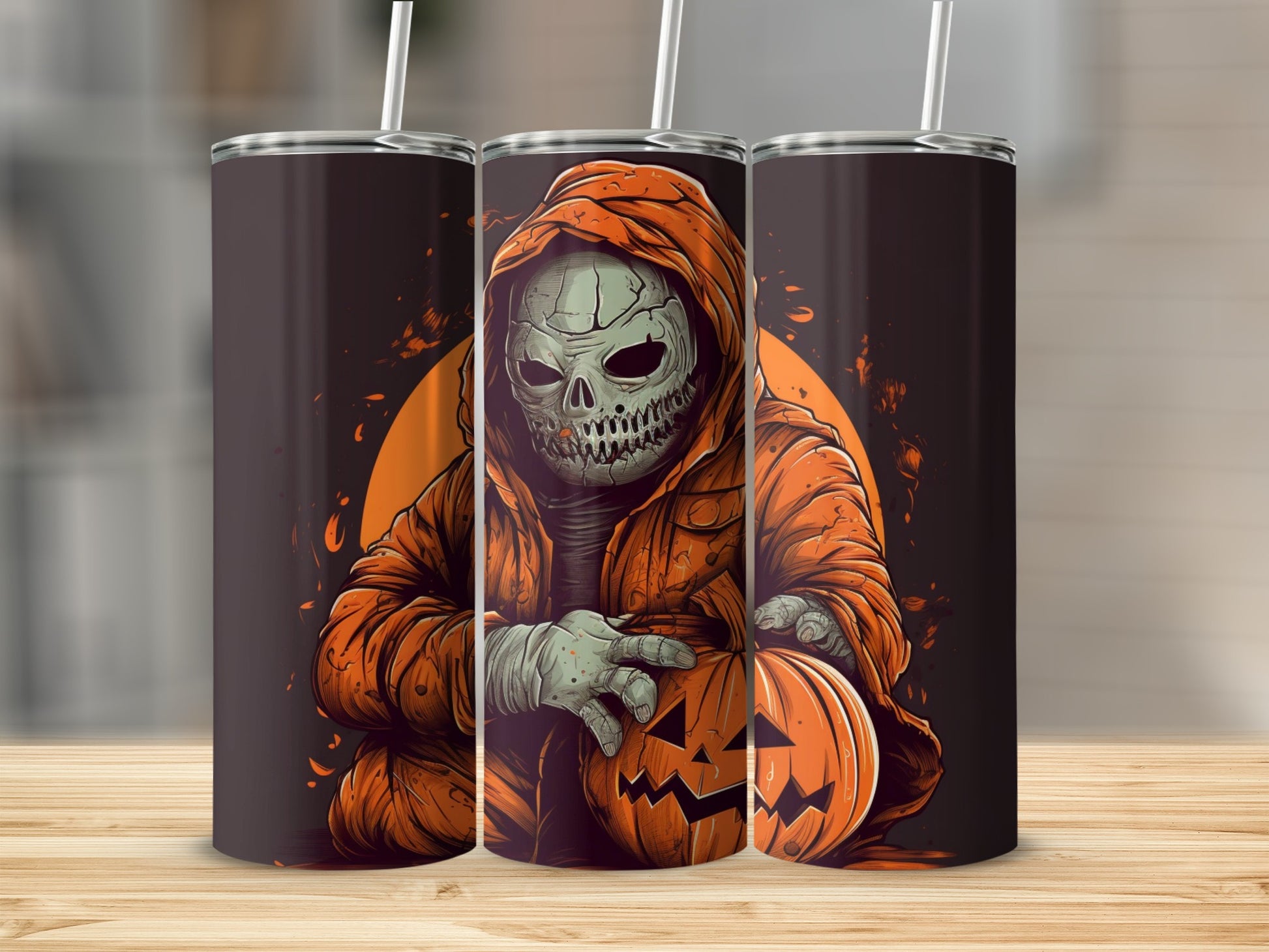 Three tumblers featuring a skeleton in an orange robe holding a jack-o'-lantern.