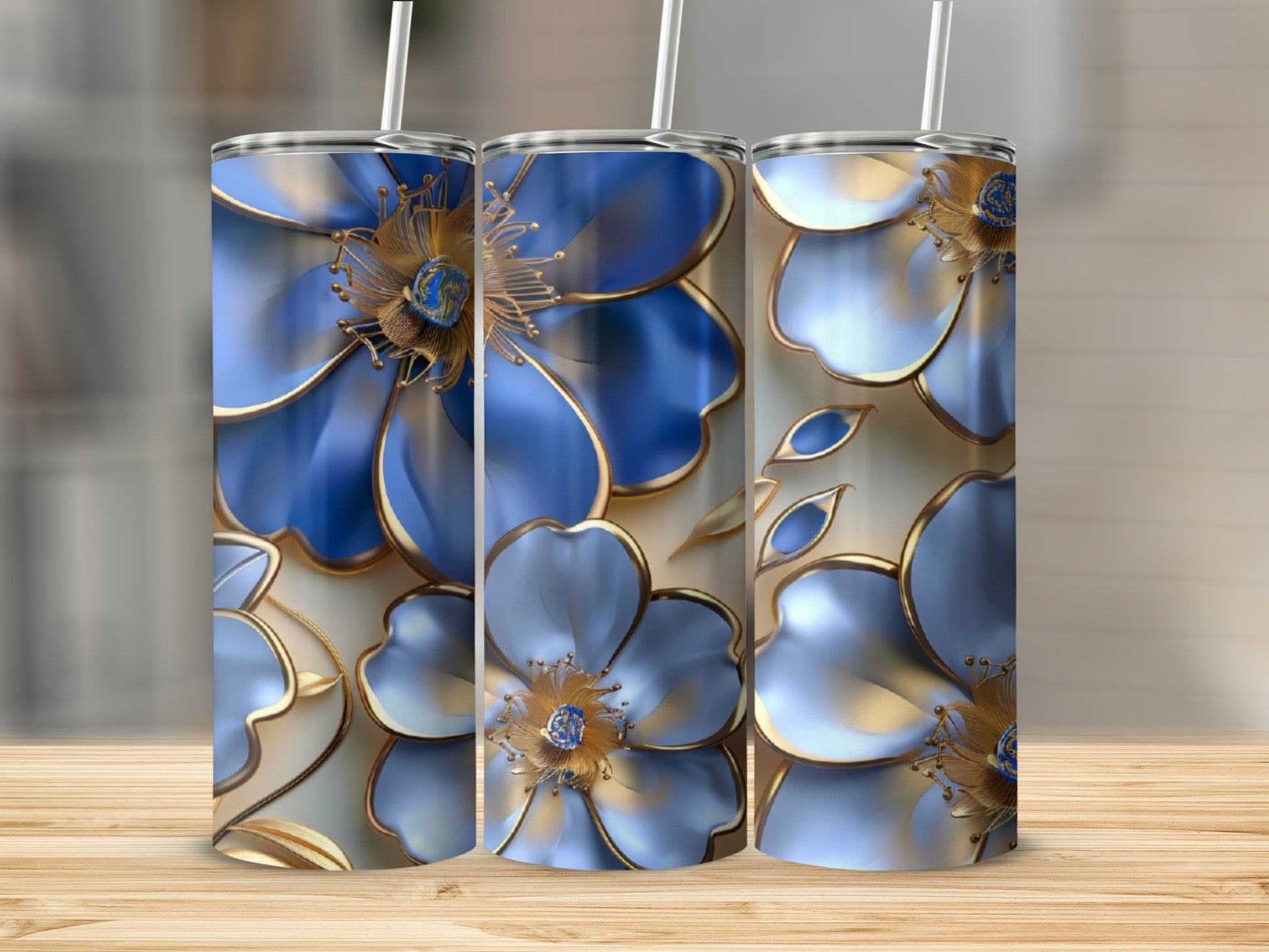 Three tall tumblers with a blue and gold floral design.