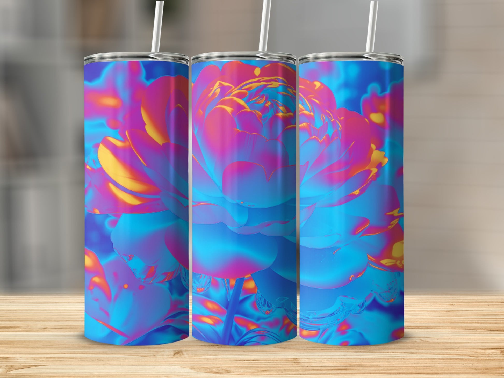 Triptych of tumblers with vibrant floral design on a wooden surface.