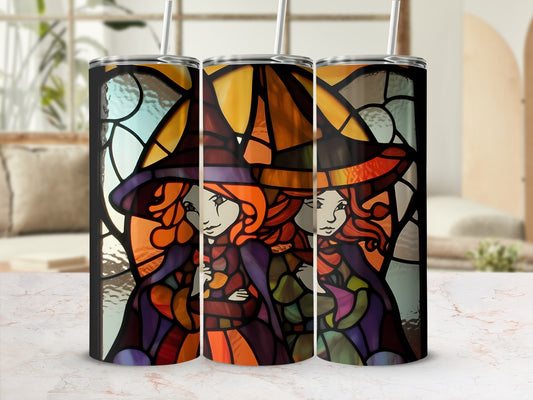 Two witches with purple and orange hats stand before stained glass.
