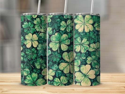 Three green tumblers with a repeating shamrock pattern.