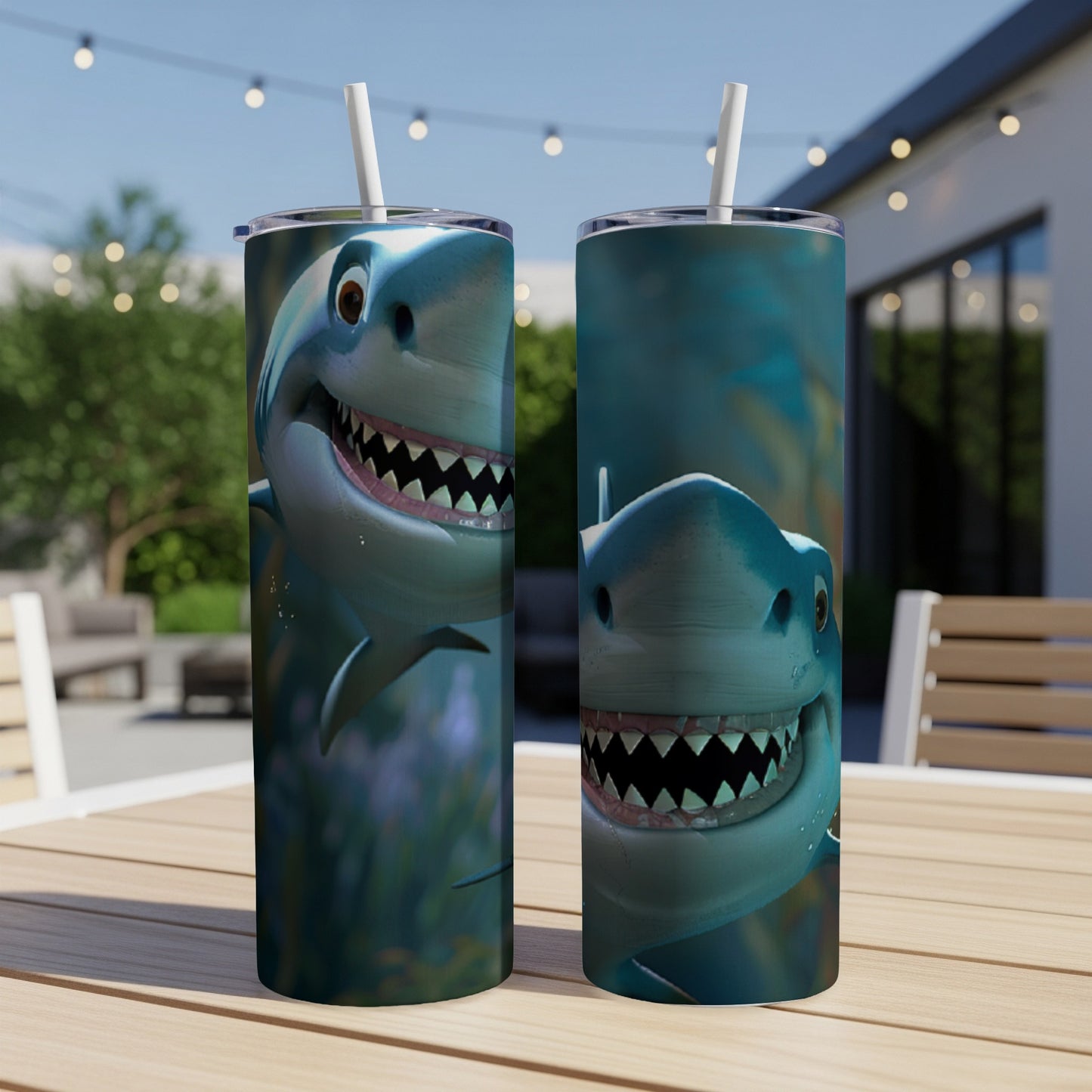 Two cartoon sharks with wide grins on cylindrical tumblers with straws.