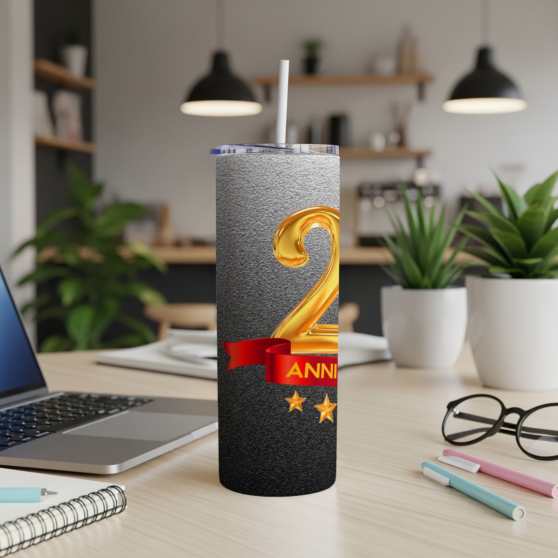 Gold "2nd Anniversary" text on a textured black and grey tumbler with a red ribbon.