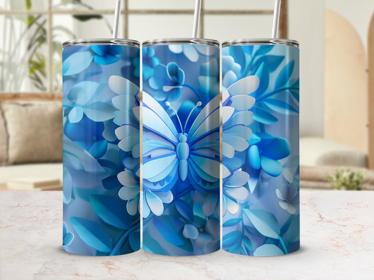Blue butterfly and floral design on three tumblers.