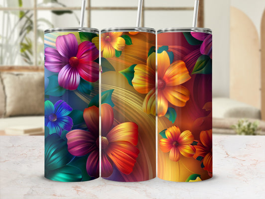 Three tumblers with colorful floral designs in a gradient of blues, purples, oranges, and yellows.