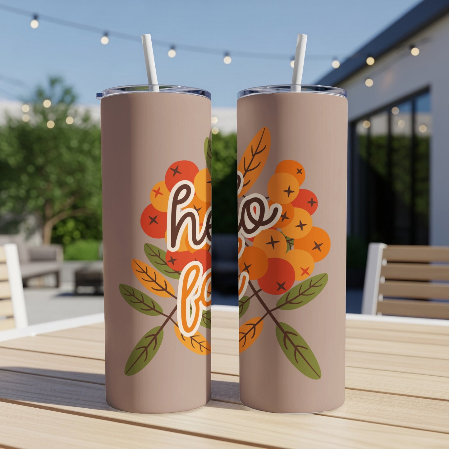 Two tumblers with "hello fall" text and autumn berry and leaf design.