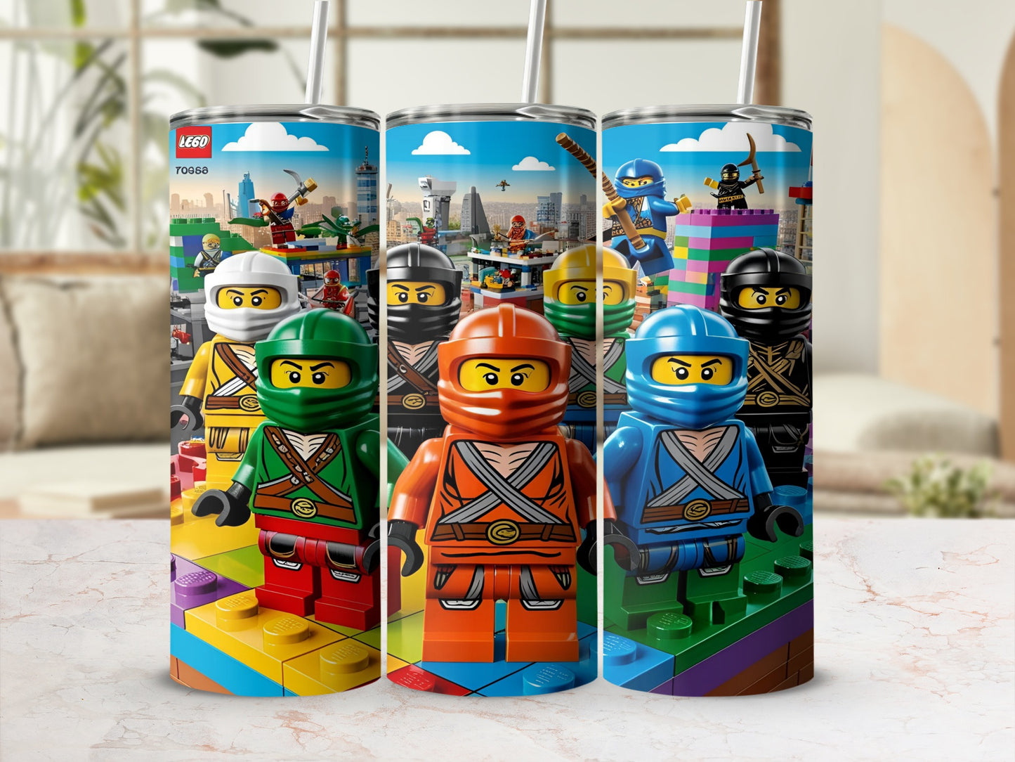 Three Lego Ninjago tumblers featuring characters and building blocks.