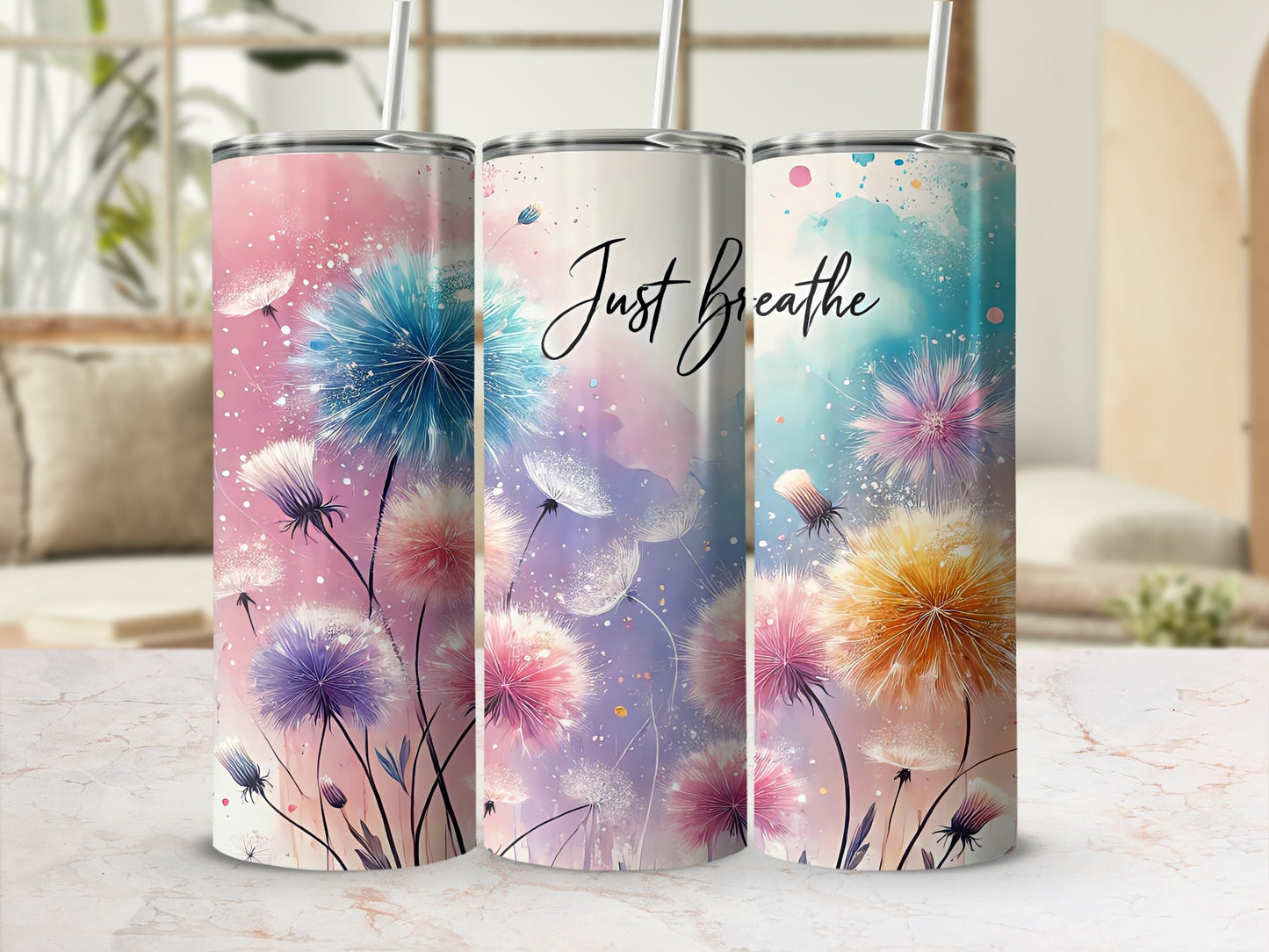 Three tumblers featuring dandelion designs and "Just Breathe" text.