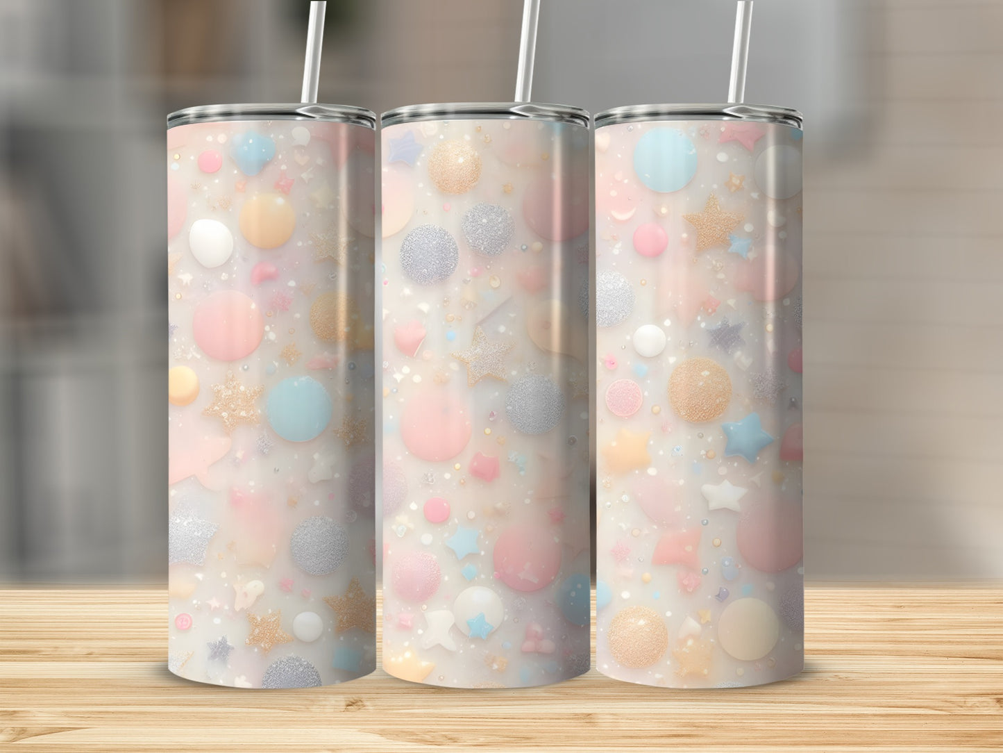 Three pastel tumblers with a confetti pattern of stars, circles, and glitter.