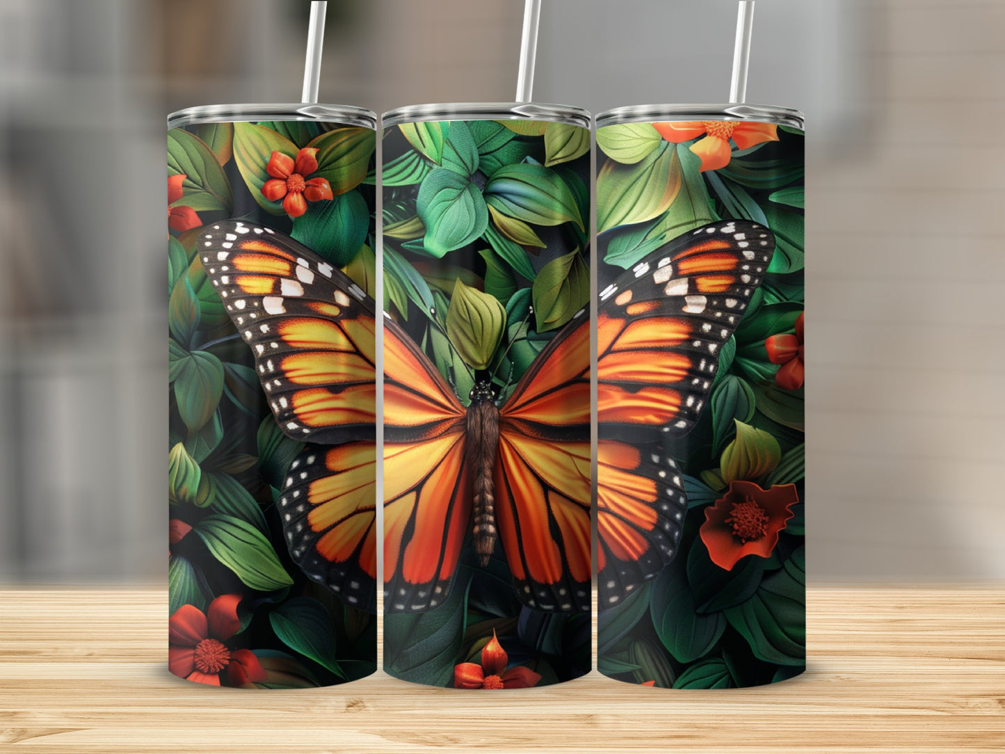 Triptych of tumblers featuring a monarch butterfly and floral pattern.