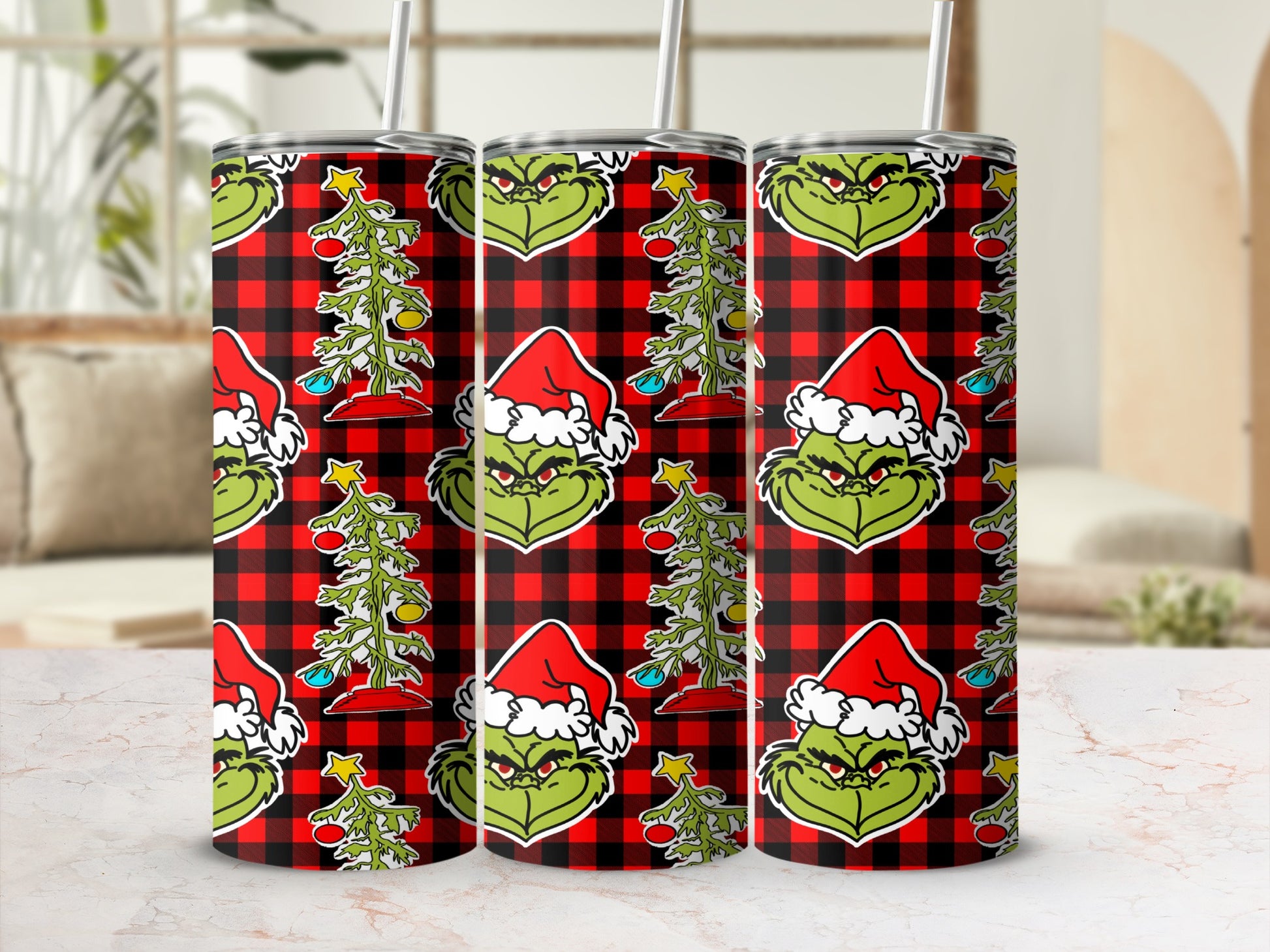 Grinch design on red plaid tumbler with Christmas tree.