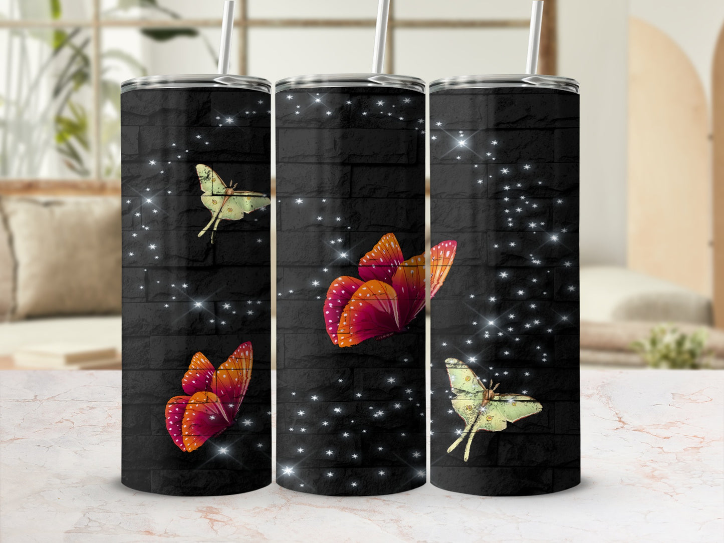 Three tumblers with a black brick pattern and glowing butterflies.