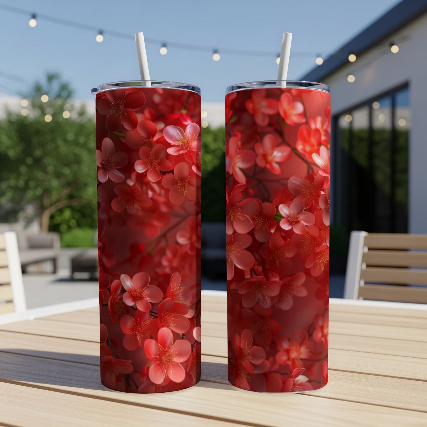 Two tall tumblers with a red floral cherry blossom design.
