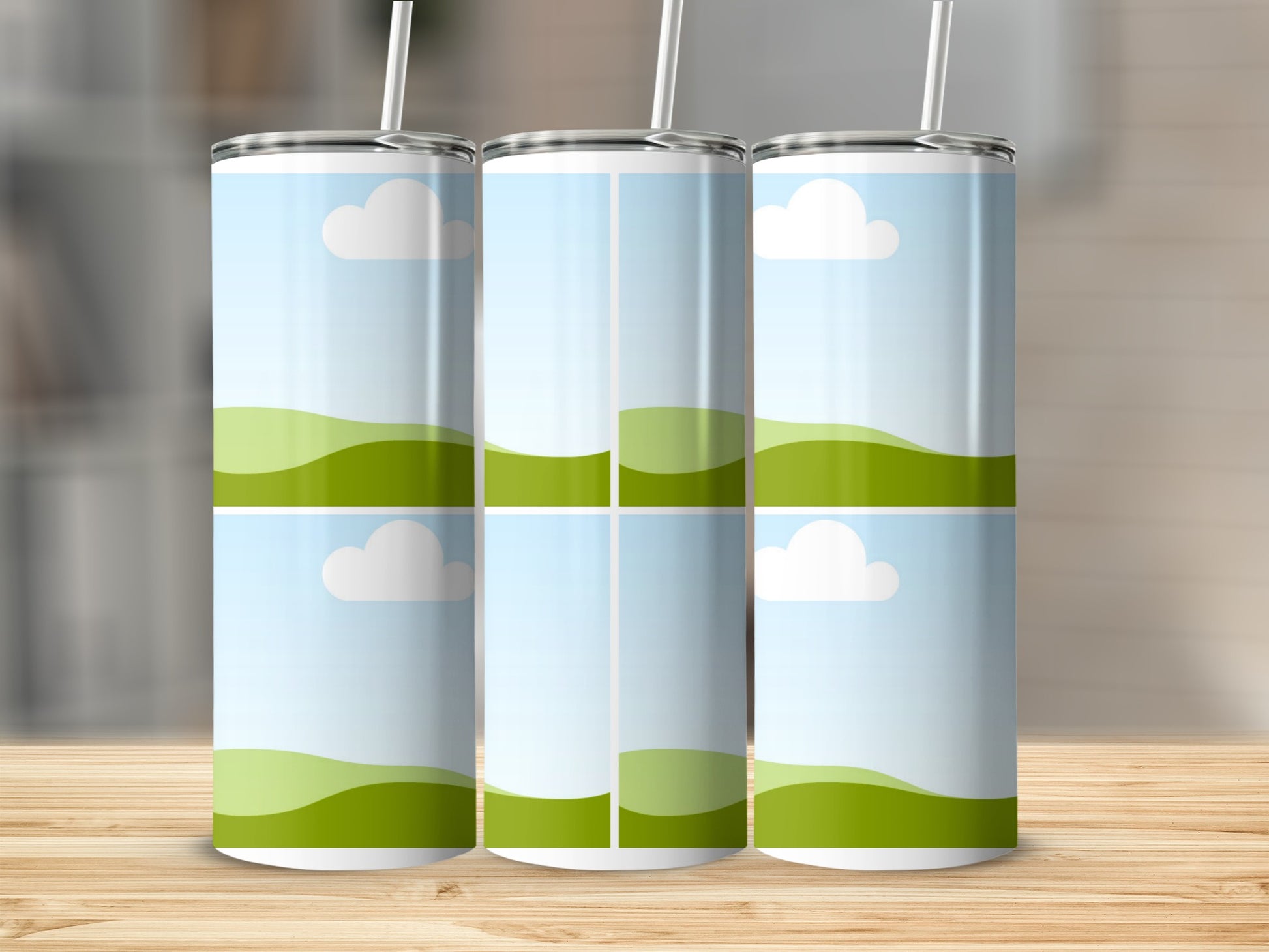 Three tumblers with a sky and rolling green hills design.