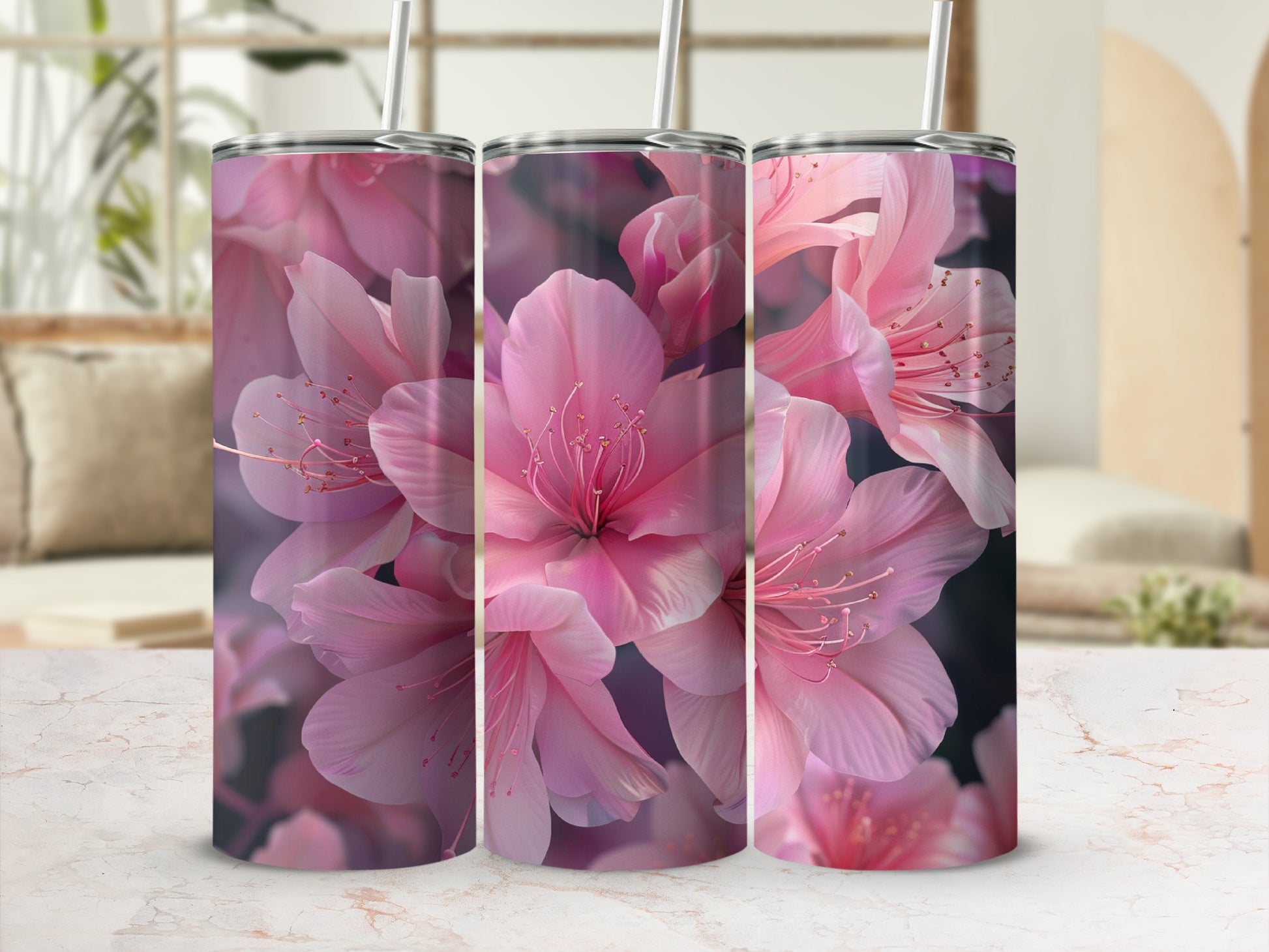 Pink cherry blossoms on a tumbler, displayed on a marble counter.