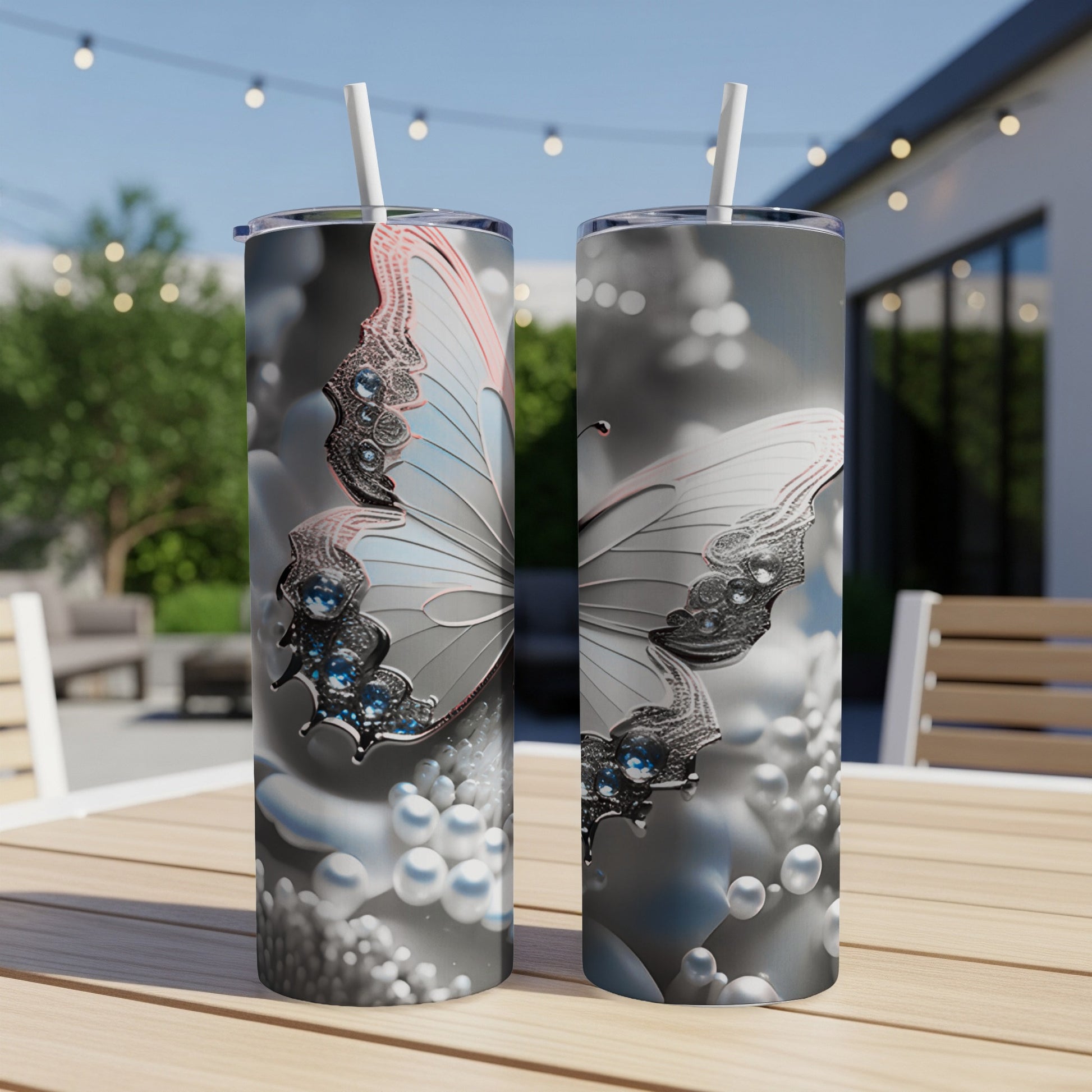 Two tumblers featuring a detailed butterfly design with pearl accents.