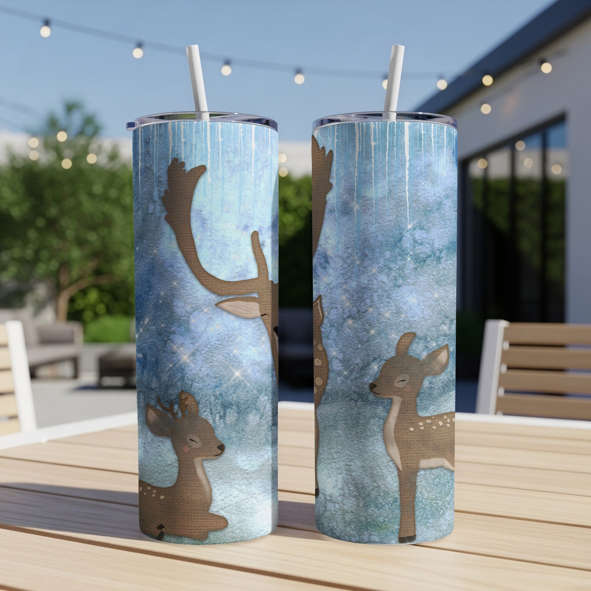 Two tumblers with a woodland deer and starry blue background design.