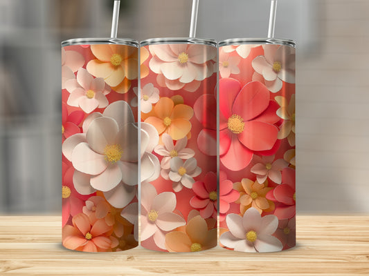 Three tumblers with floral patterns in shades of pink and orange.