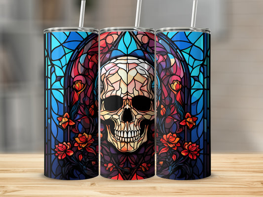 Stained glass skull tumbler with floral accents.