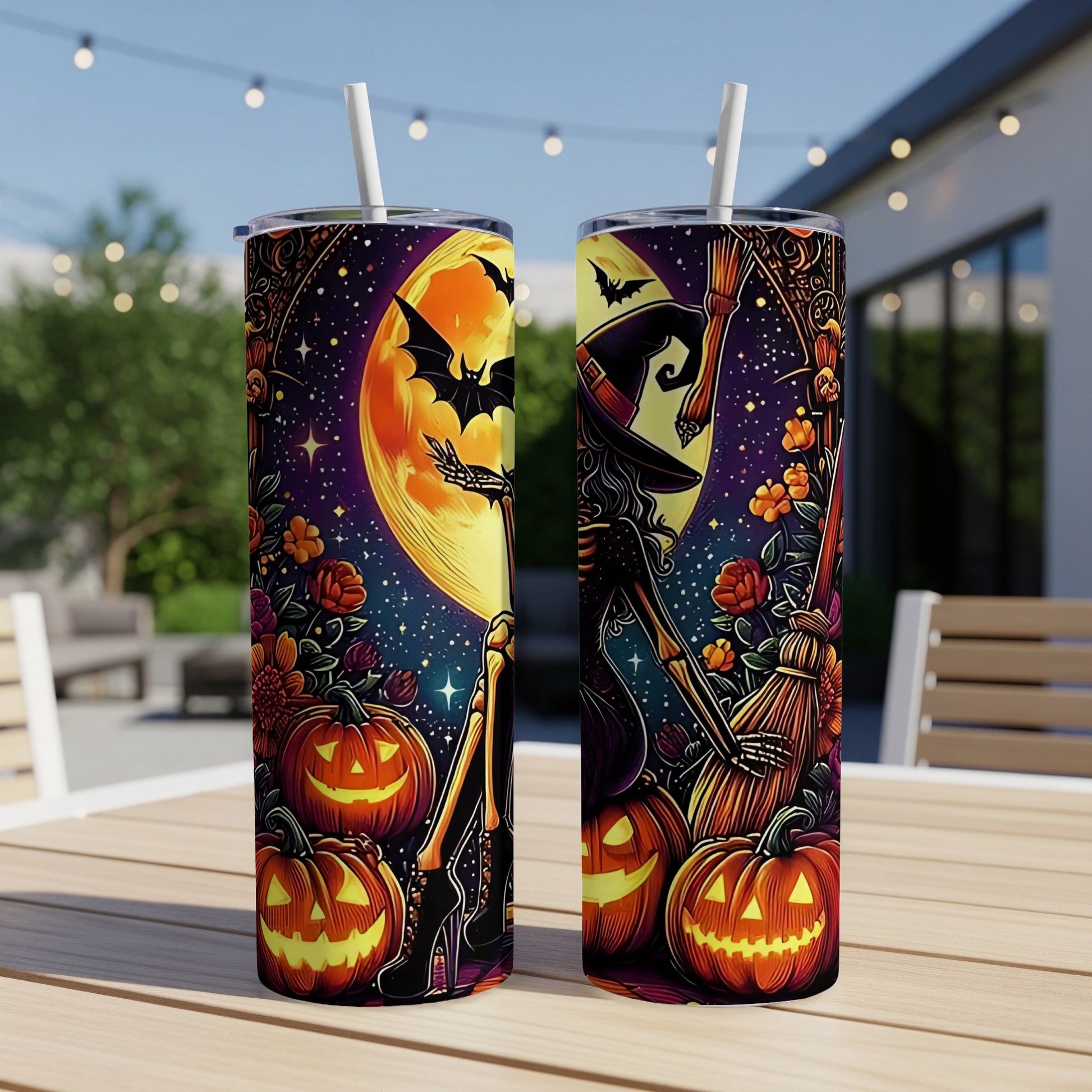 Two Halloween-themed tumblers with skeletons, pumpkins, bats, and a witch's hat.