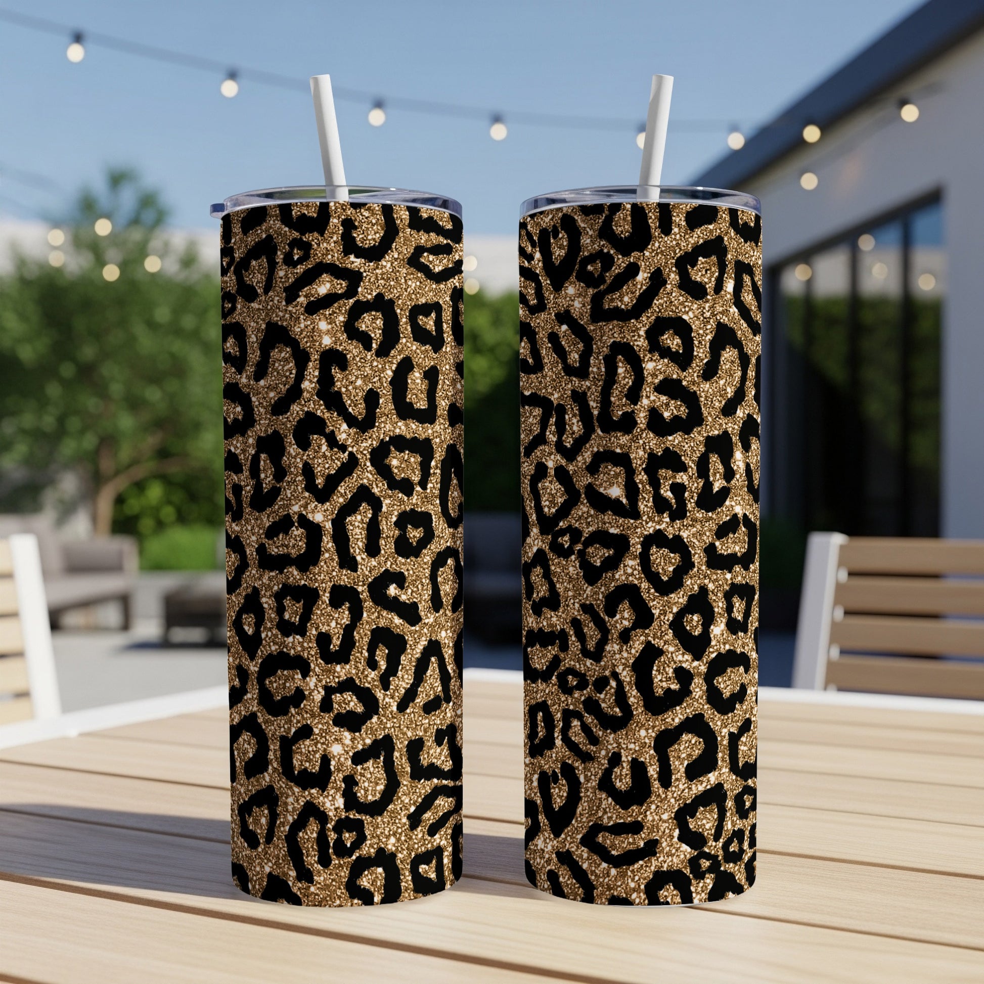 Two tall tumblers with a gold and black leopard print pattern.