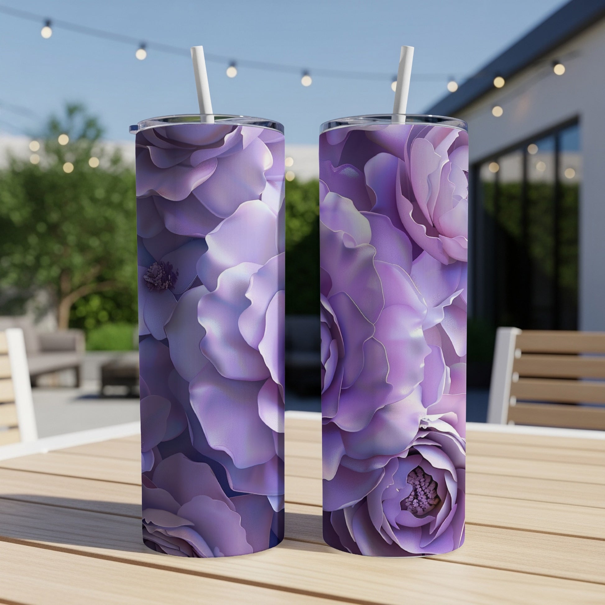 Two tall tumblers with a purple floral pattern on a wooden table.