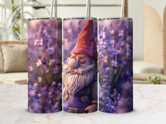 Tumbler with gnome figurine in field of purple flowers.
