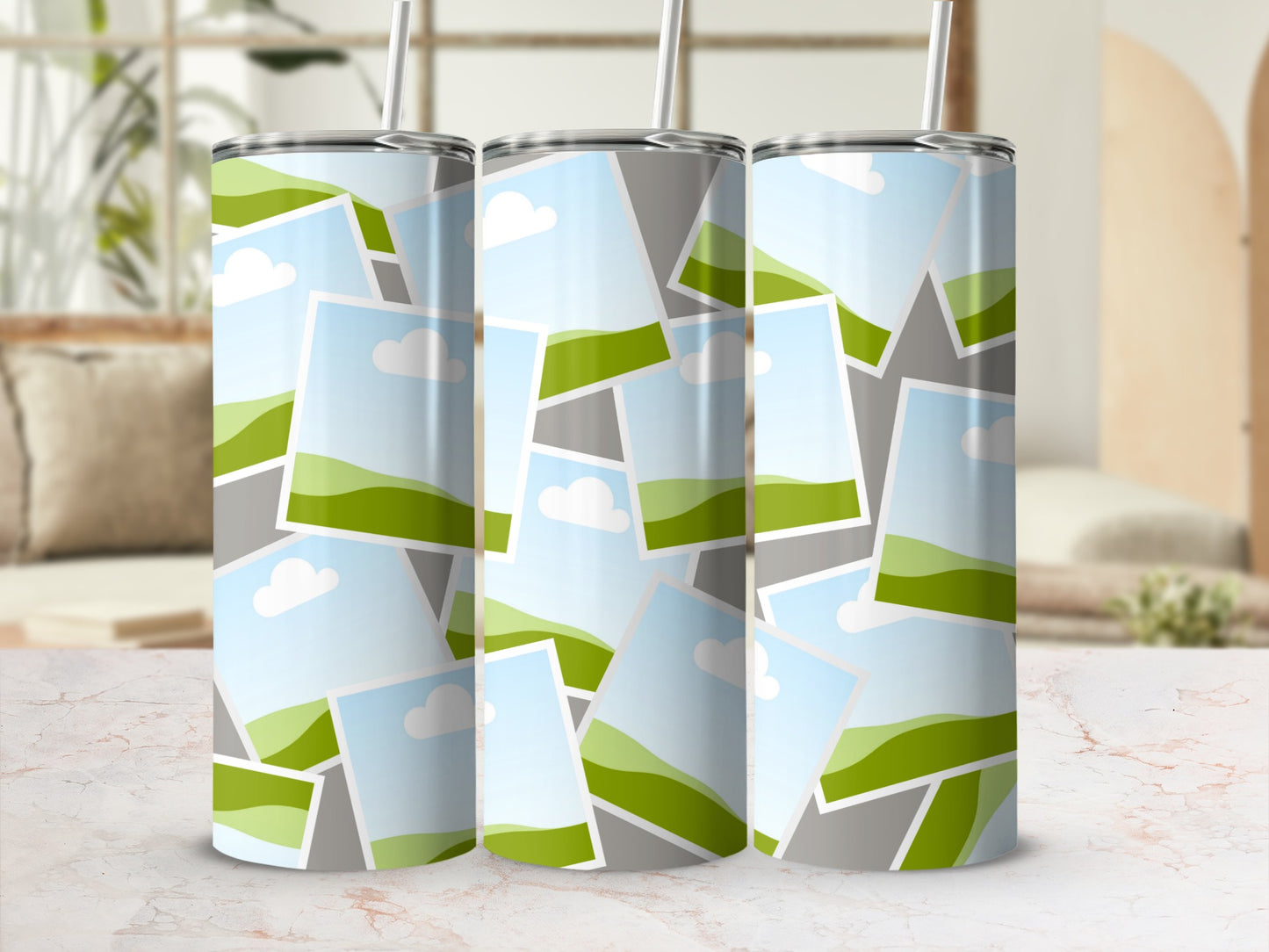 Three tumblers with a collage of landscape photos featuring green hills and blue sky.