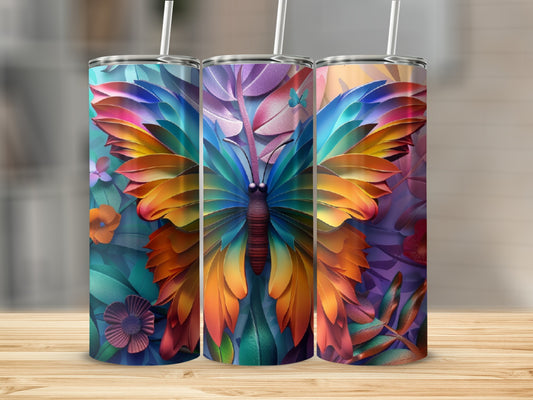 Colorful butterfly design on three skinny tumblers against a blurred floral background.