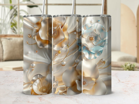Three tumblers with ornate floral and pearl designs, with a muted background.
