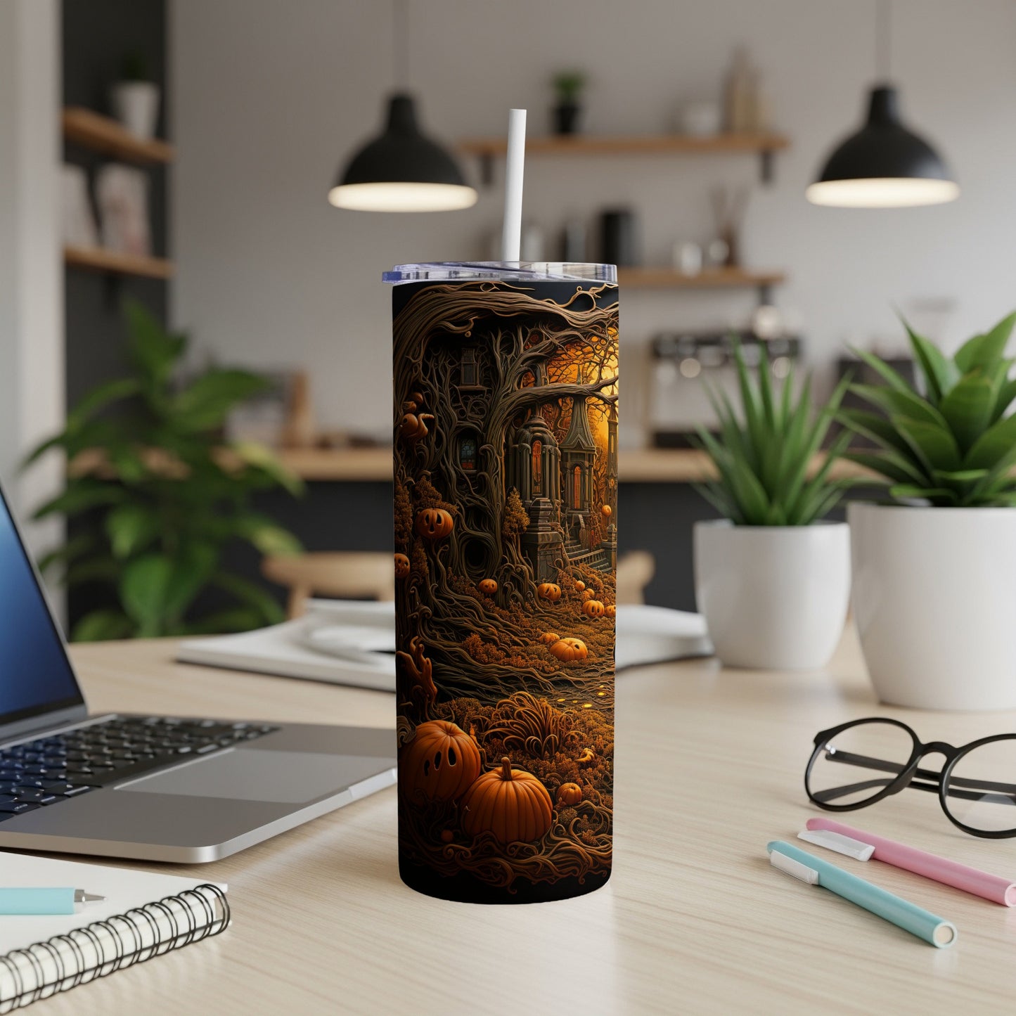 Tall tumbler with spooky Halloween forest and pumpkin illustration and white straw.