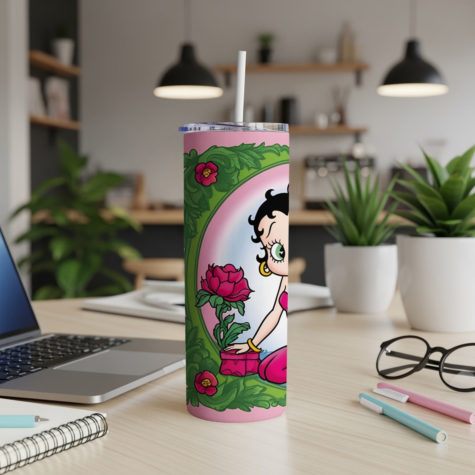 Betty Boop holding a pink flower in a decorative frame on a tumbler.