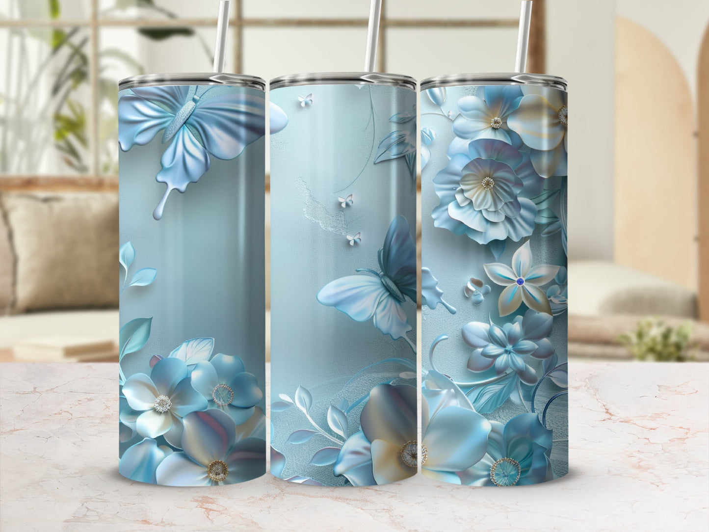 Blue floral and butterfly design on three cylindrical tumblers.