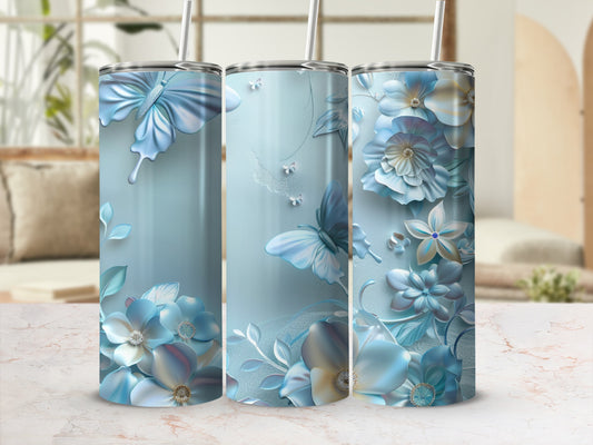 Blue floral and butterfly design on three cylindrical tumblers.