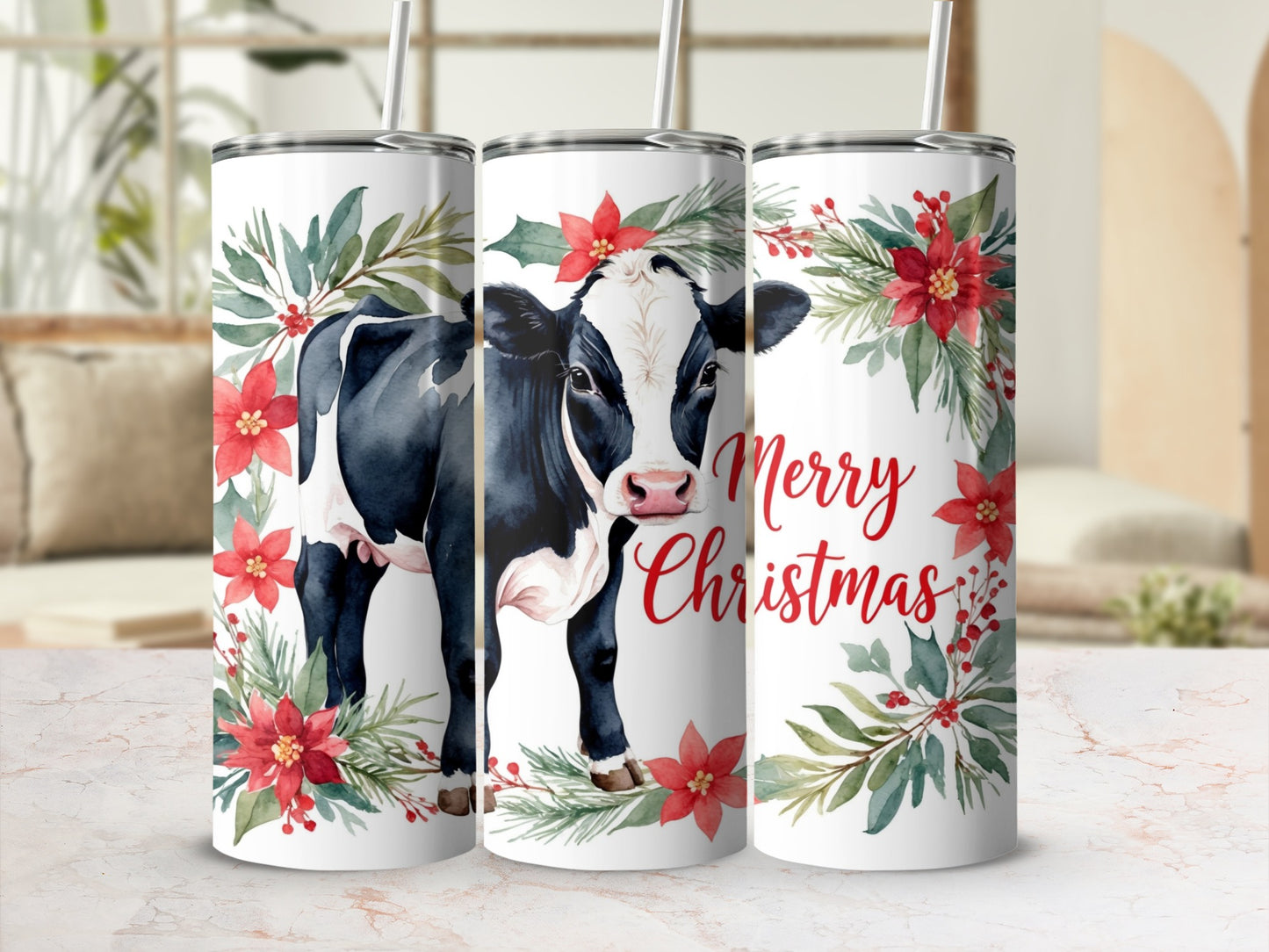 Black and white cow with poinsettias and "Merry Christmas" text on a tumbler.