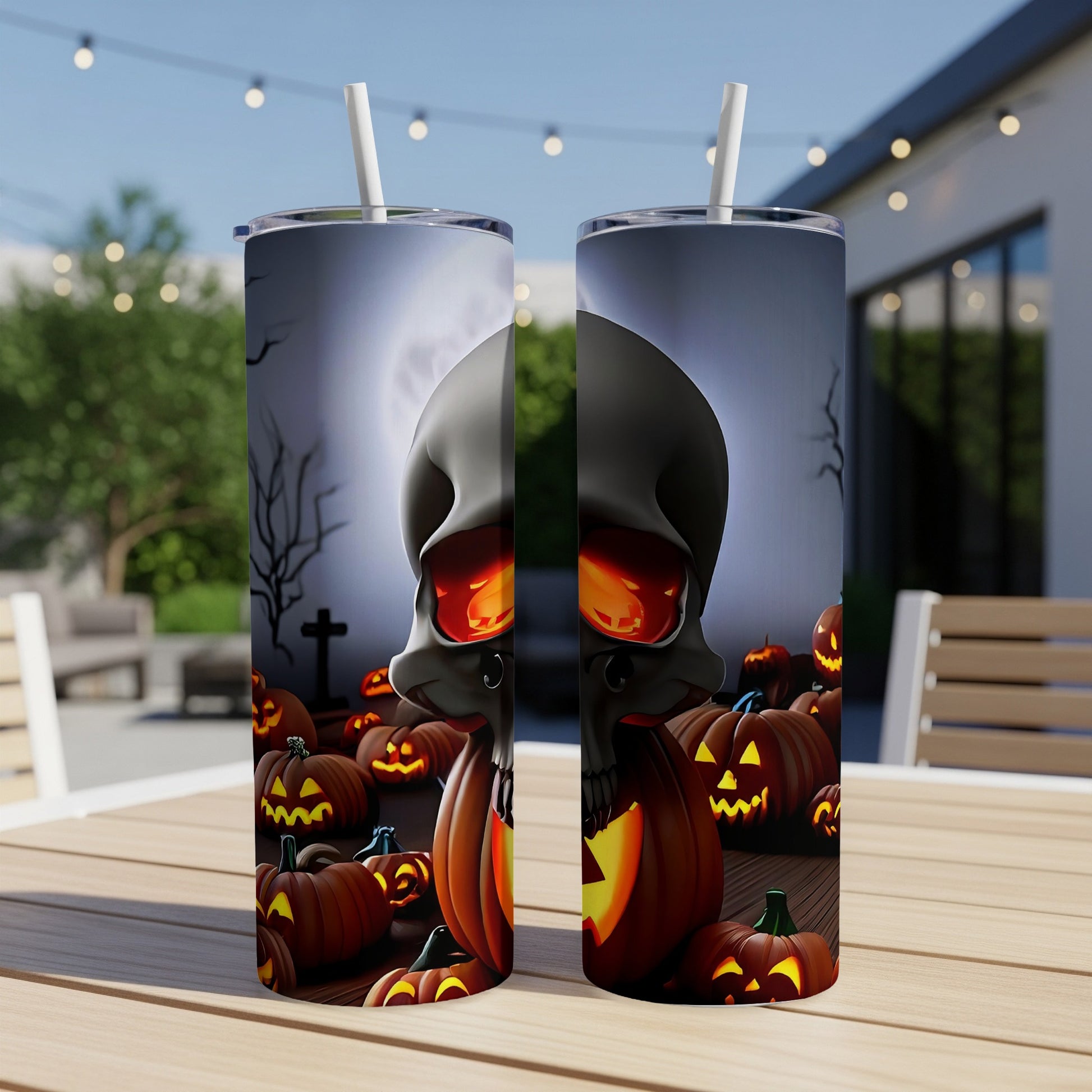 Two tumblers with a spooky Halloween design featuring a skull and pumpkins.