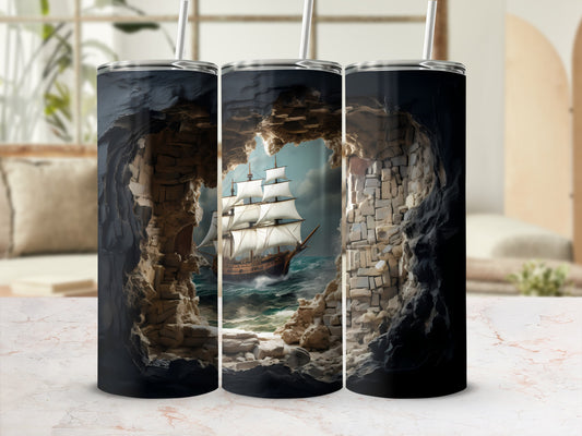 Tumbler with a sailing ship emerging from a rocky cave opening.