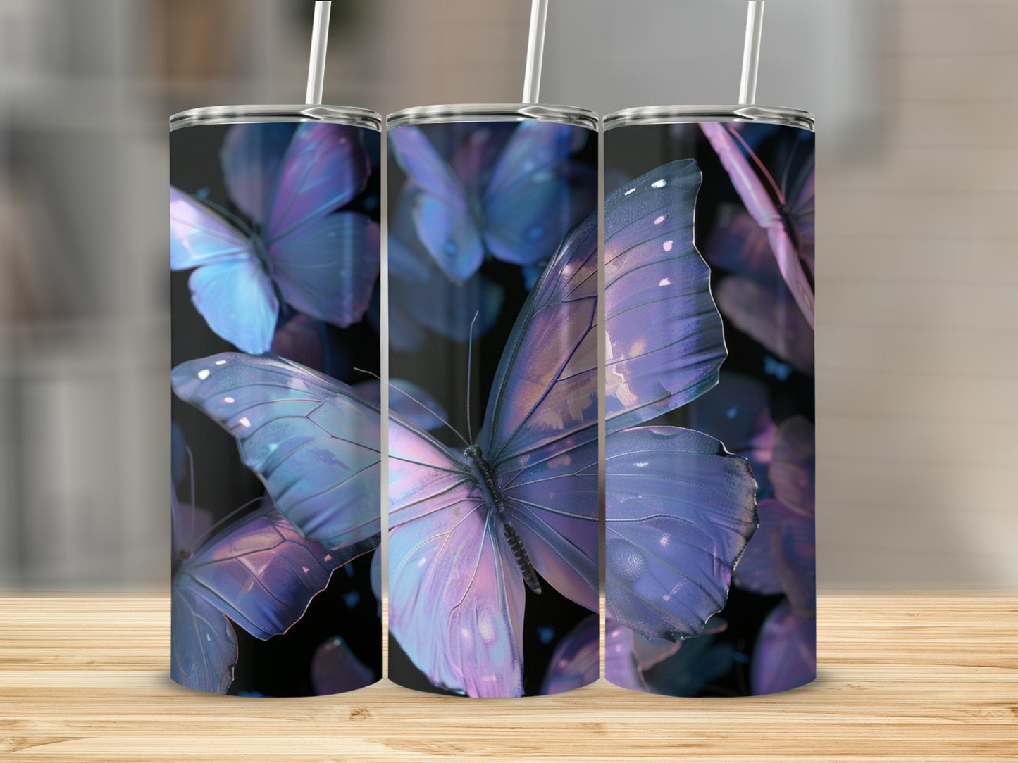 Three tumblers with iridescent blue and purple butterfly designs.