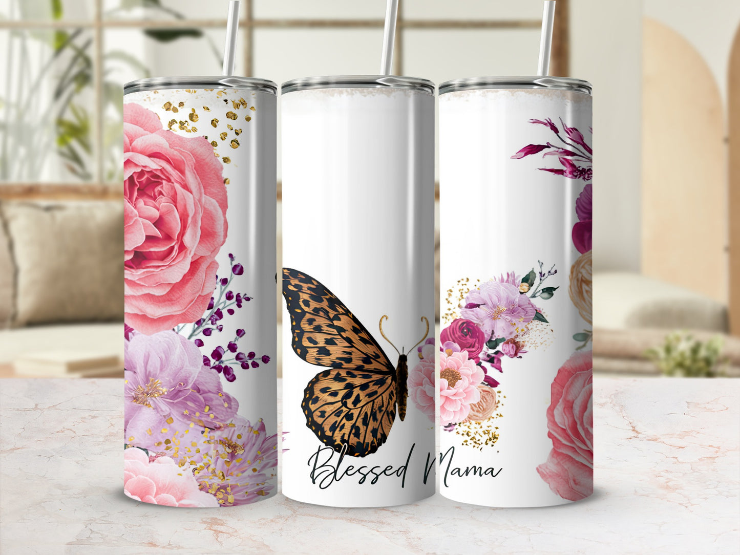 White tumbler with floral design and butterfly, reads "Blessed Mama".