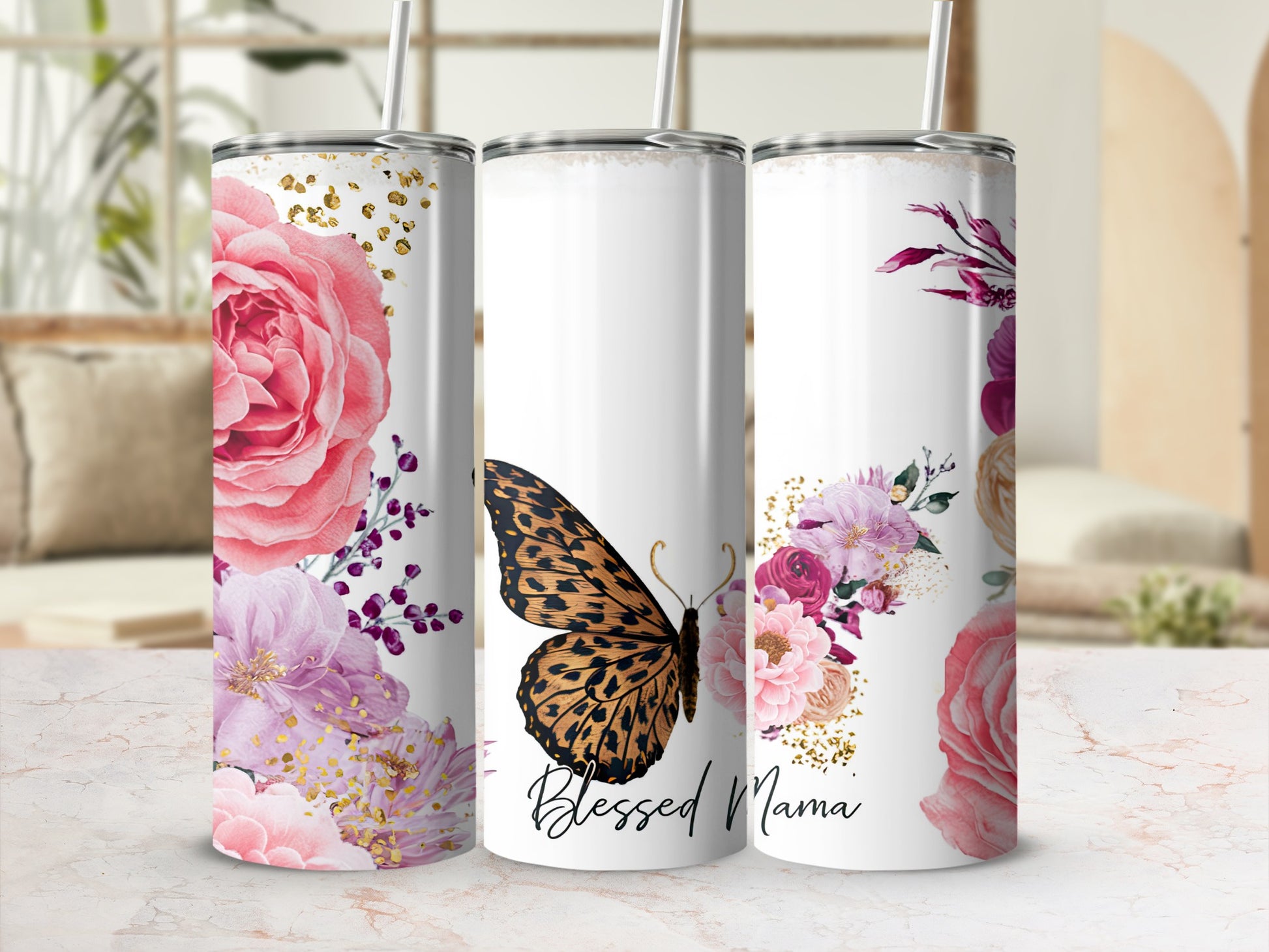 White tumbler with floral design and butterfly, reads "Blessed Mama".