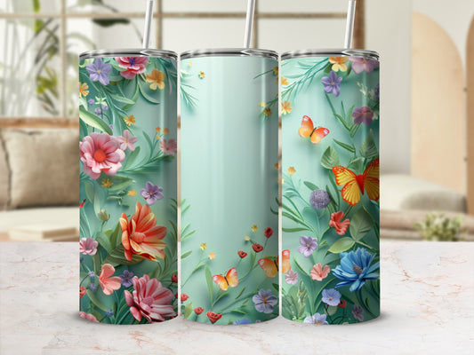 Three tumblers with a floral and butterfly design on a mint green background.