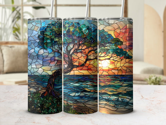 Three tumblers with stained glass tree and sunset designs.