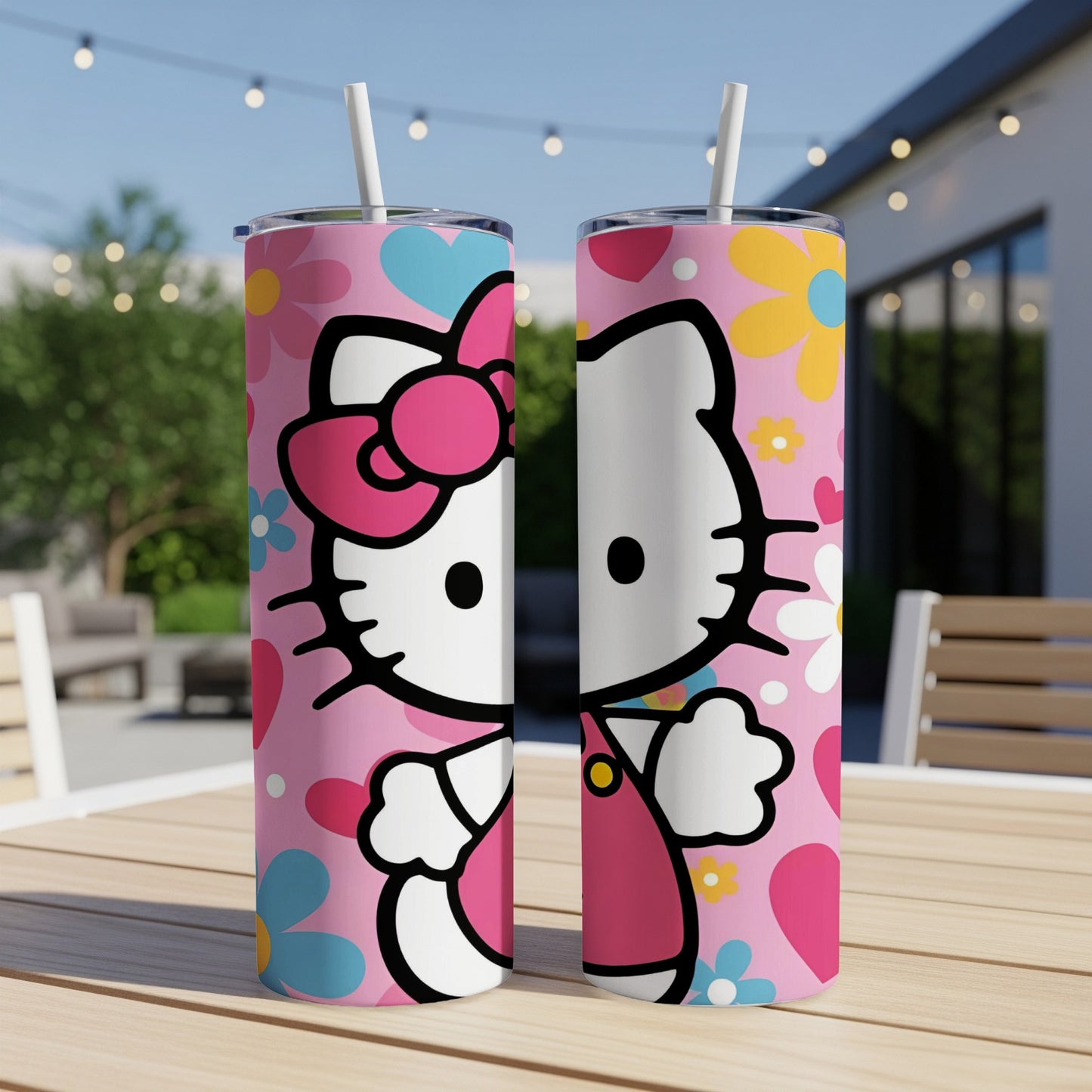Two pink tumblers with Hello Kitty's face and floral patterns.