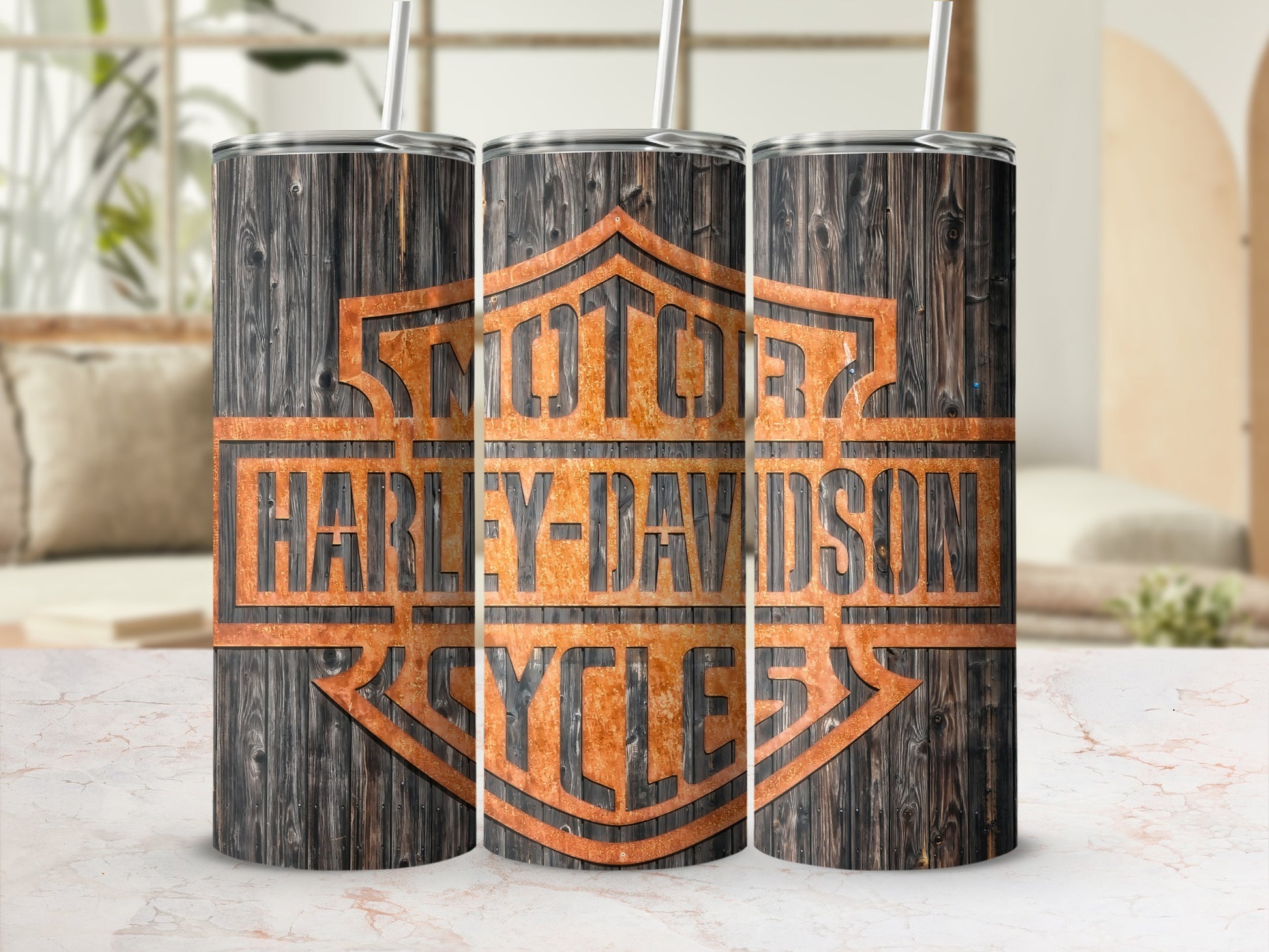 Three tumblers featuring the Harley-Davidson Cycles logo on a wood grain background.