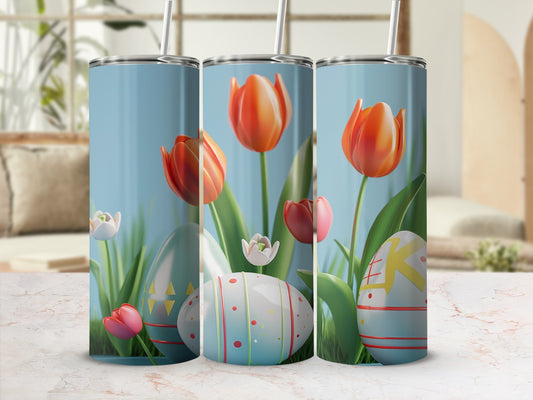 Three tumblers with floral and Easter egg designs in a staged setting.