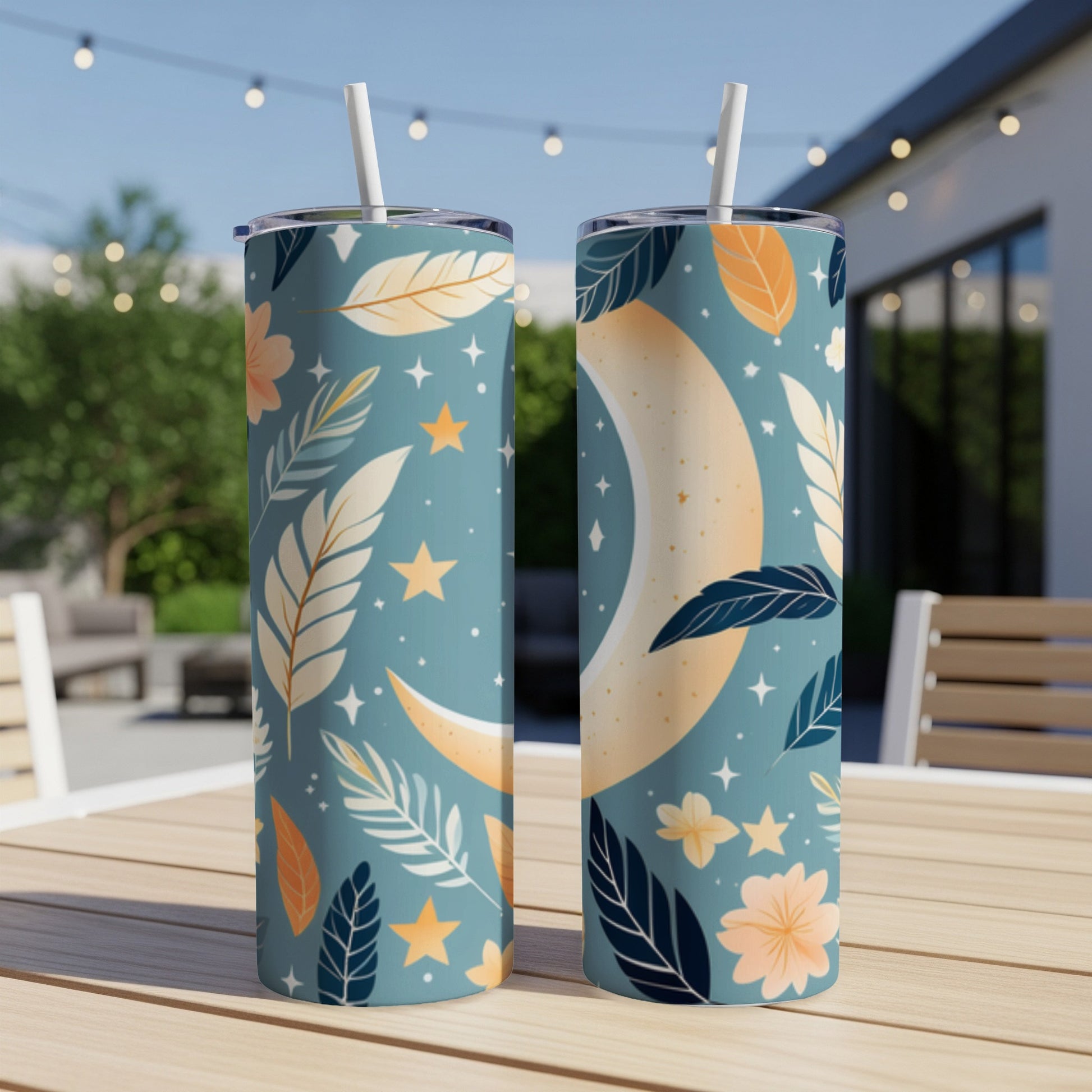 Two tall tumblers with a celestial moon and floral leaf pattern.